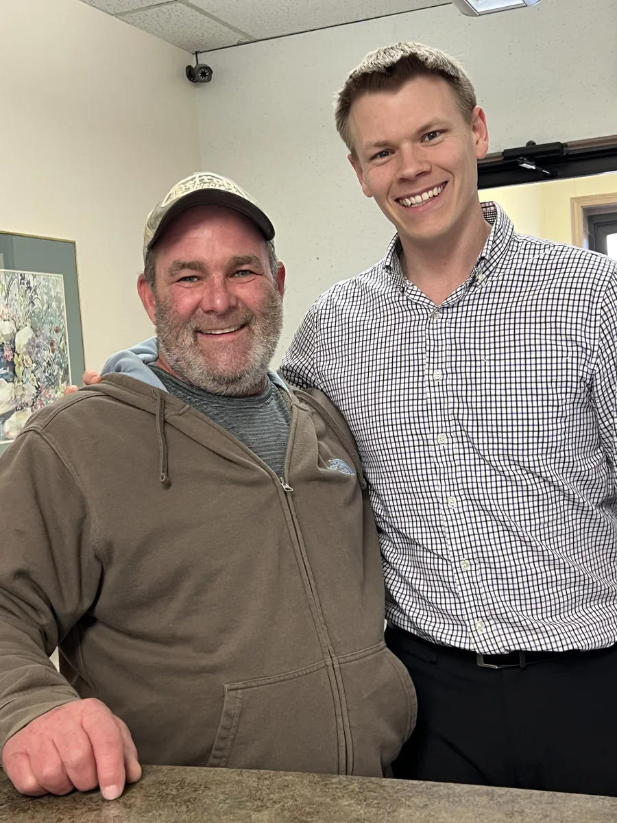 Dr. Jonathan Waltman with a patient at the front desk